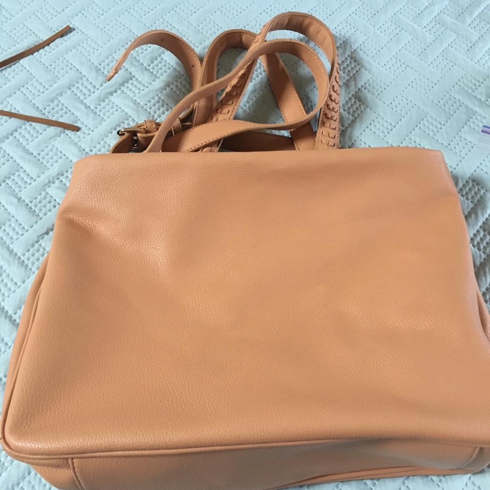 Tan colored shoulder bag.